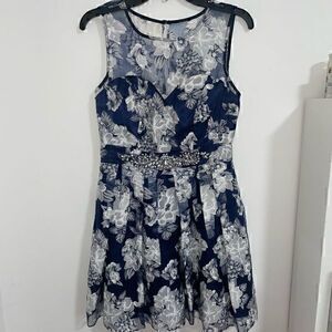 Blue and navy juniors short A line dress with floral print and beaded waist